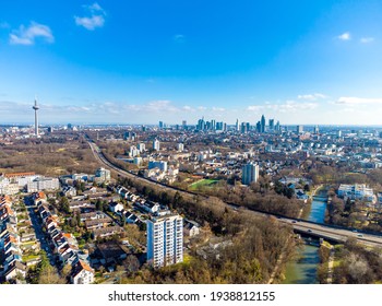 Beautiful Aerial View On European Finance Center City Frankfurt Am Main Downtown Skyline From Park Niddapark, Nidda River In Spring. Blue Sky, Clouds, Green Trees. Hesse, Germany.