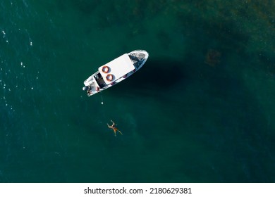 Beautiful aerial view on white sea boat and people jumping and swimming in the Black sea blue water. Summer vacations for fun - Powered by Shutterstock