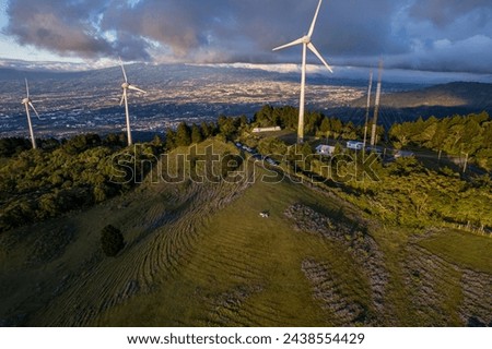 Beautiful aerial view of the renewable energy Windmills in Costa Rica at the sunset