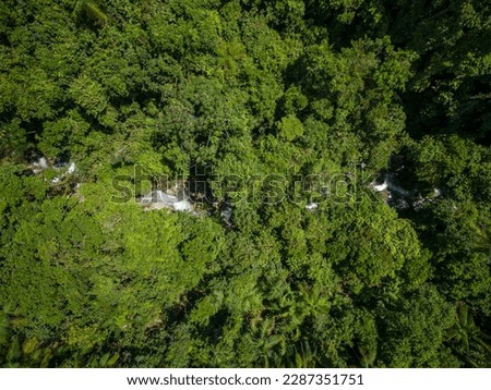 Beautiful aerial view to river on green atlantic forest mountain, Serrinha do Alambari, Rio de Janeiro, Brazil