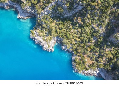 Beautiful aerial view of sea lagoon with blue water, Mediterranean, Turkey.  Small rocky island among sea.  The bottom of the sea from above. - Shutterstock ID 2188916463