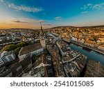 Beautiful aerial view of the St. Peter church in the city of Zurich in Switzerland and its iconic churches, buildings rivers and Clockes.