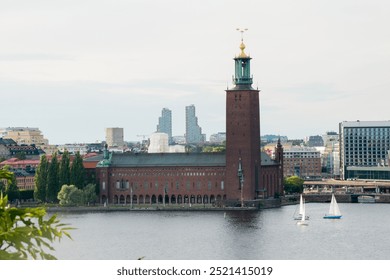 Beautiful aerial view of Stockholm city hall. Waterfront. Modern buildings in the distance. Sweden - Powered by Shutterstock