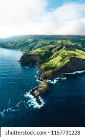 Beautiful Aerial View of Tropical Island Paradise Nature Scene of Maui Hawaii On Clear Sunshine Blue Sky Day with Vibrant Blue Ocean Water and Waves and Lush Green Mountain Scenic Landscape 