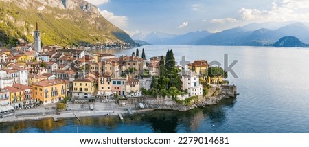 Beautiful aerial waterfront cityscape of Varenna, one of the most picturesque towns on the shore of Lake Como. Charming location with typical Italian atmosphere. Varenna, Lombardy, Italy.