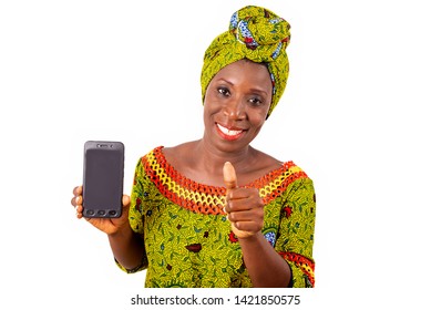 Beautiful African Adult Woman Dressed In Loincloth And Green Scarf Is Happy Showing Thumbs Up With Her Phone