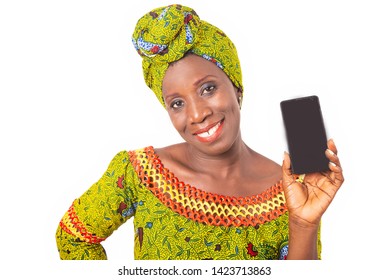 Beautiful African Adult Woman Dressed In Green Loincloth Is Smiling Showing A Mobile Phone