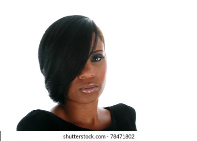 A beautiful African American adult woman models a hair style isolated on white