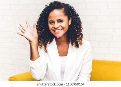 Beautiful African American Black Woman Smiling At Camera Waving And Saying Hello To You