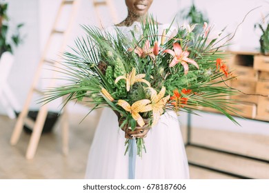 Beautiful African American Bride With Tropical Bouquet In Studio