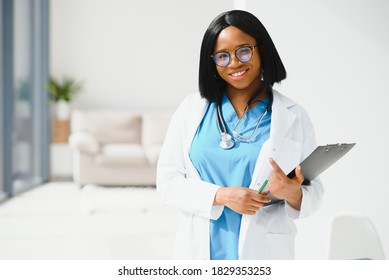 Beautiful African American Female Pediatric Nurse In Modern Office