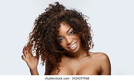Beautiful african american girl with an afro hairstyle smiling