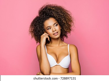 Beautiful african american girl with an afro hairstyle thinking