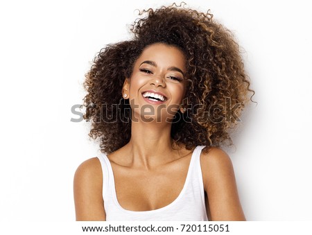 Beautiful african american girl with an afro hairstyle smiling Foto stock © 