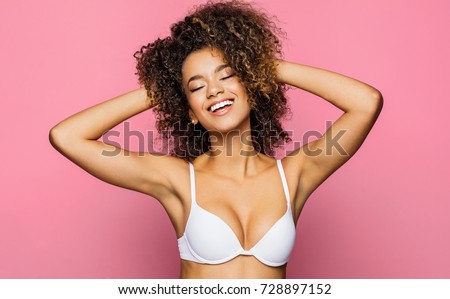 Beautiful african american girl with an afro hairstyle smiling
