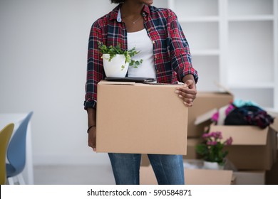 Beautiful African  American girl moving in the new apartment - Powered by Shutterstock