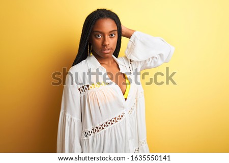 Beautiful african american girl wearing bikini and summer dress smiling happy