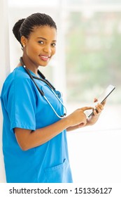 Beautiful African American Health Care Worker Using Tablet Computer