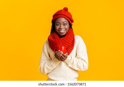 Beautiful African American Winter Girl Enjoying Hot Tea Or Coffee, Holding Red Mug, Copy Space