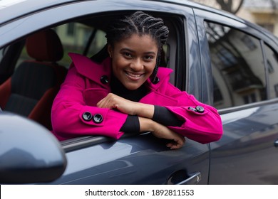 The Beautiful African American Woman In A Car