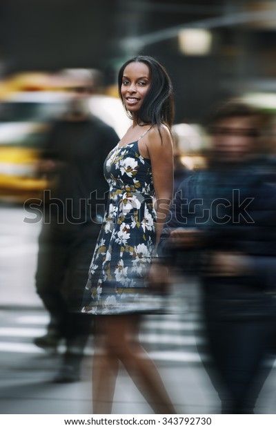 Beautiful african american woman walking on New\
York City street