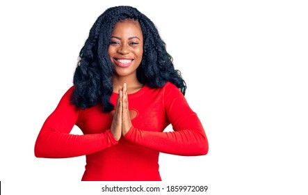 Beautiful African American Woman Wearing Casual Clothes Praying With Hands Together Asking For Forgiveness Smiling Confident. 