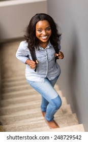 Beautiful African College Girl Walking Up The Stairs On Campus