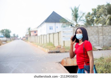 Beautiful African College Student Making A Phone Call Wears Face Mask Standing Outside