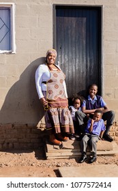 Beautiful African Family Infront Of Their House In The Township.