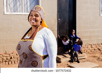 Beautiful African Family Outside Their House In The Township.