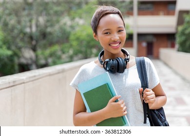 Beautiful African Female College Student With Headphones On Campus