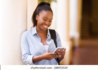 Beautiful African University Student Texting On Smart Phone