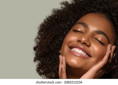 Beautiful african woman black t-shirt portrait afro haircut touching her face Color background green - Shutterstock ID 2083213234