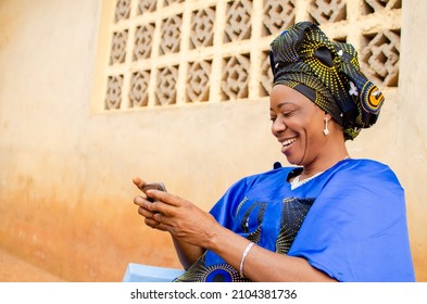 beautiful african woman feeling excited as operating her cellphone