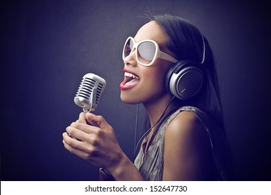 Beautiful African Woman Singing With The Microphone