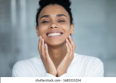 Beautiful African Woman Touch Face Enjoy Ideal Flawless Fresh Smooth Facial Skin Close Up Portrait. Laser Skin Resurfacing, Glycolic Acid Peel, Anti-ageing Skincare Procedures And Cosmetics Ad Concept