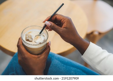 Beautiful African-american Woman's Hands With Cold Latte In Coffee Shop. Coffee Break. Coffee Latte With Ice. Coffee Mood In Summer Time.