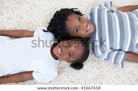 Beautiful Afro American Brother And Sister On Floor With Heads Together Beautiful Afro American Brother And Sister On Floor With Heads Together