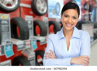 Beautiful Agent Woman In Car Repair Service Over Tire Background.