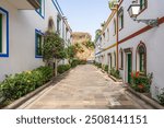 A beautiful alley in Puerto de Mogan. Puerto de Mogan is a picturesque fishing village and popular marina, set on the south-west coast of the island of Gran Canaria. Canary Islands. Spain.