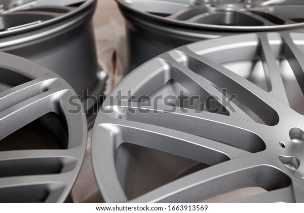Beautiful alloy car wheels in forged aluminum with\
knitting needles and titanium silver. Auto service industry and\
spare parts.