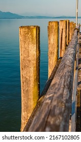 Beautiful alpine summer view with details of a pier at the famous Chiemsee, Bavaria, Germany