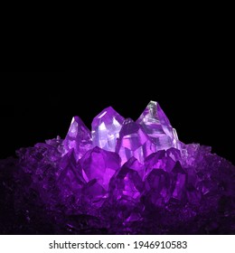 Beautiful Amethyst crystal isolated on a black background. Natural light reflections on Amethyst. Copy space.