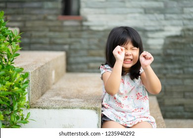 Beautiful Angry Little Girl Looking At Camera.Mad Kid Got Upset And Sad And She Has A Negative Attitude.Depressed Little Girl Complaining.Attention Deficit Hyperactivity Disorder (ADHD) Concept