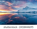 Beautiful Antarctica landscape, mountains next to the sea with breathtaking reflection during midnight sun, sunset and sunrise in once, in Antarctica