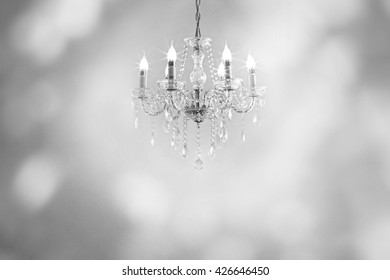 Beautiful antique crystal chandelier in the foyer. Lamp with white light.