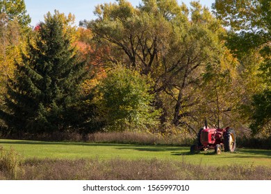 Beautiful Antique Red Tractor In A Green Rural Decor