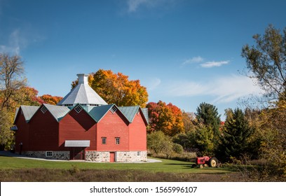 Beautiful Antique Red Tractor In A Rural Decor In Front Of A Grain Dump