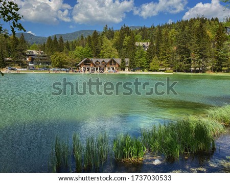 Beautiful apline lake Jasna in national park Triglav in Slovenia in a spring sunny day. Travel, wanderlust concept