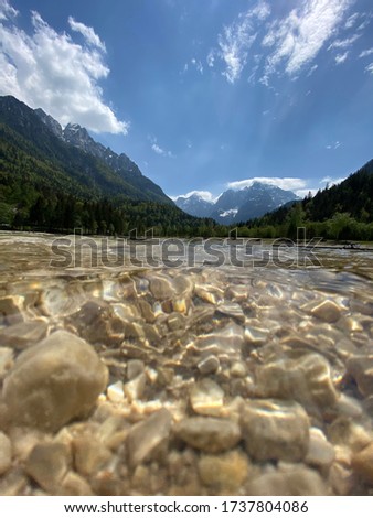 Beautiful apline lake Jasna in national park Triglav in Slovenia in a spring sunny day. Travel, wanderlust concept